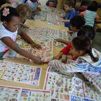 Children working on a craft project at a table