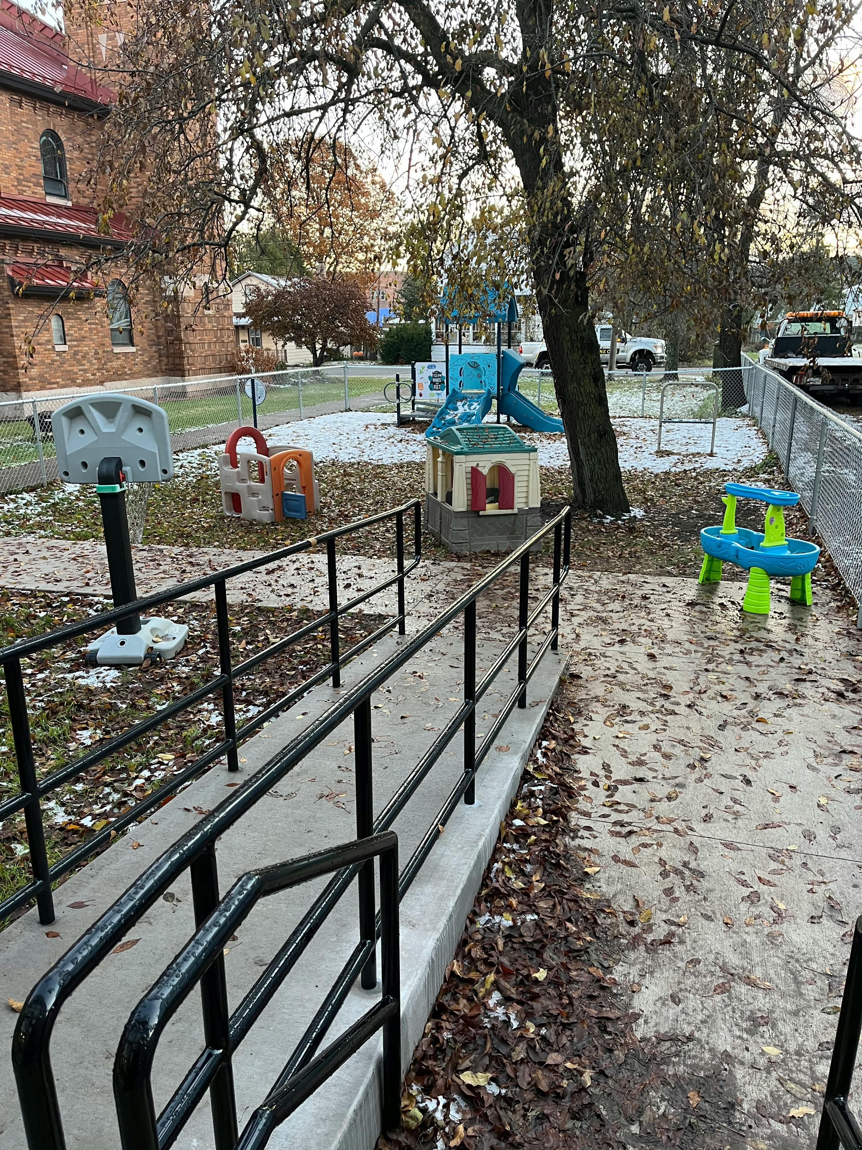 Playground with various equipment and a ramp leading to it