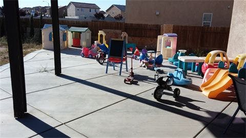 Patio with various children's play equipment
