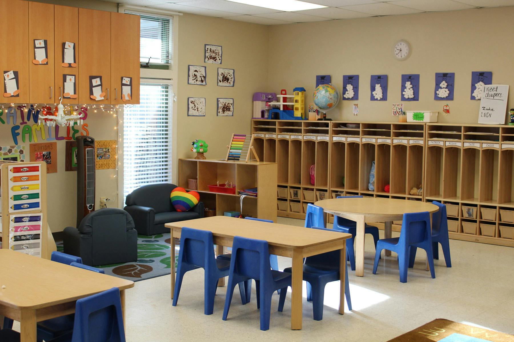 Empty classroom with small tables and chairs