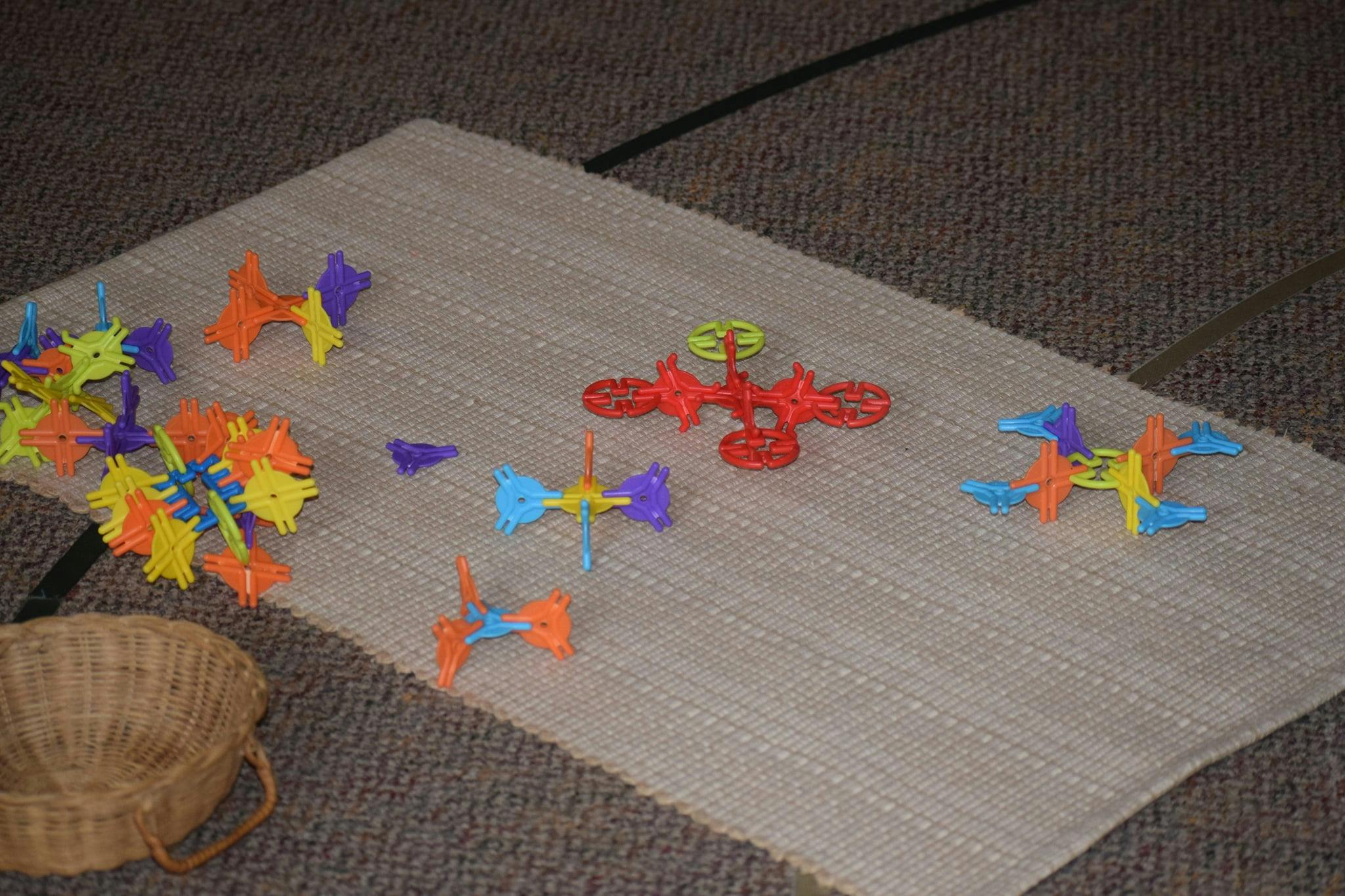 Colorful interlocking toys on a mat