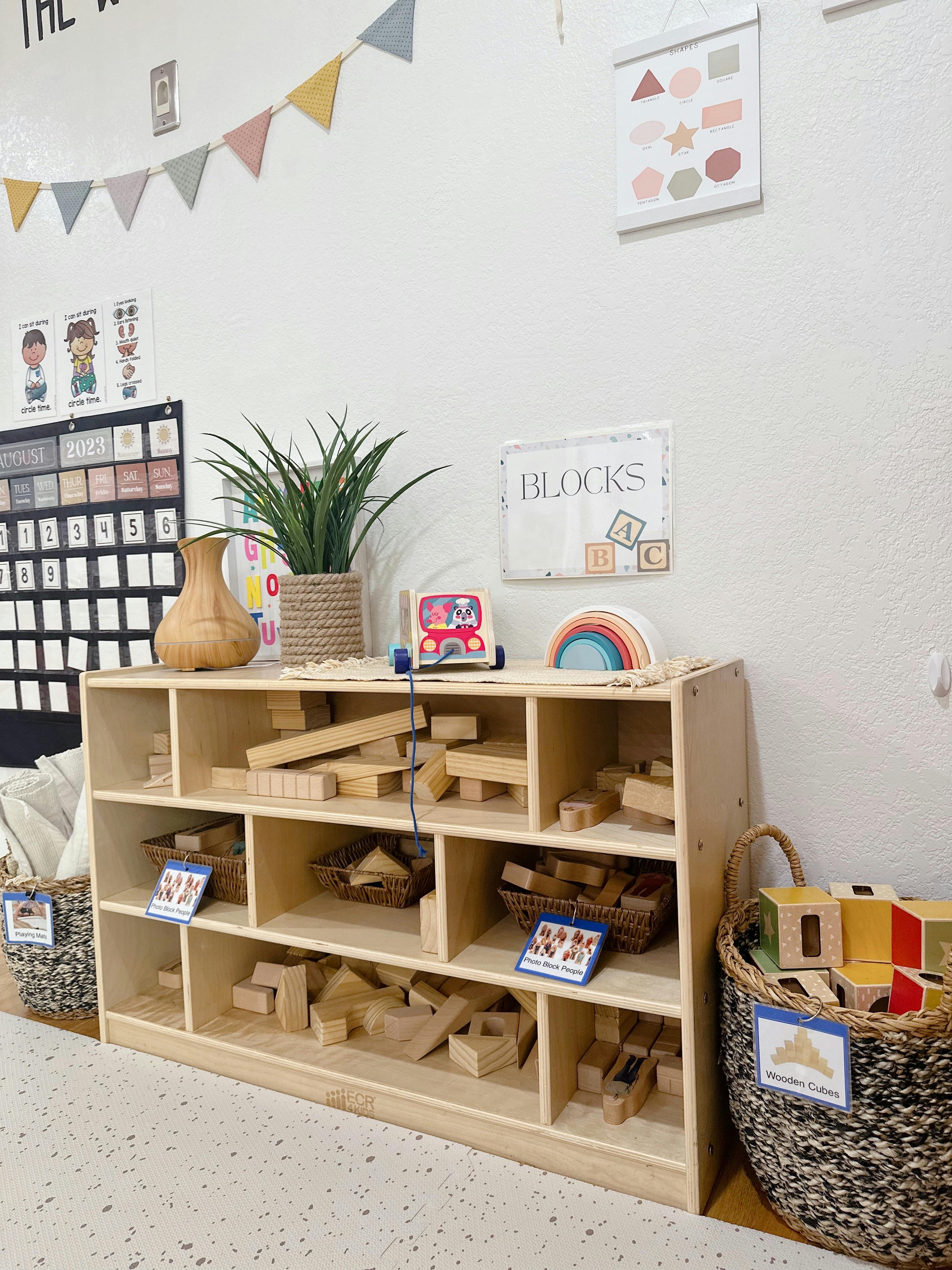 Wooden shelving unit with blocks and toys in a classroom