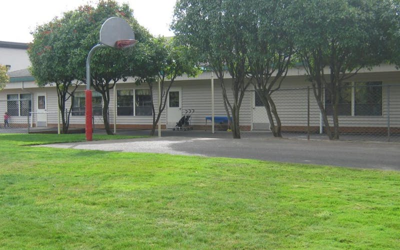 Basketball hoop on a playground next to a building