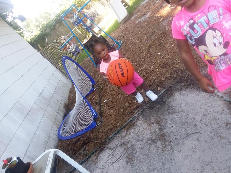 Child holding a basketball