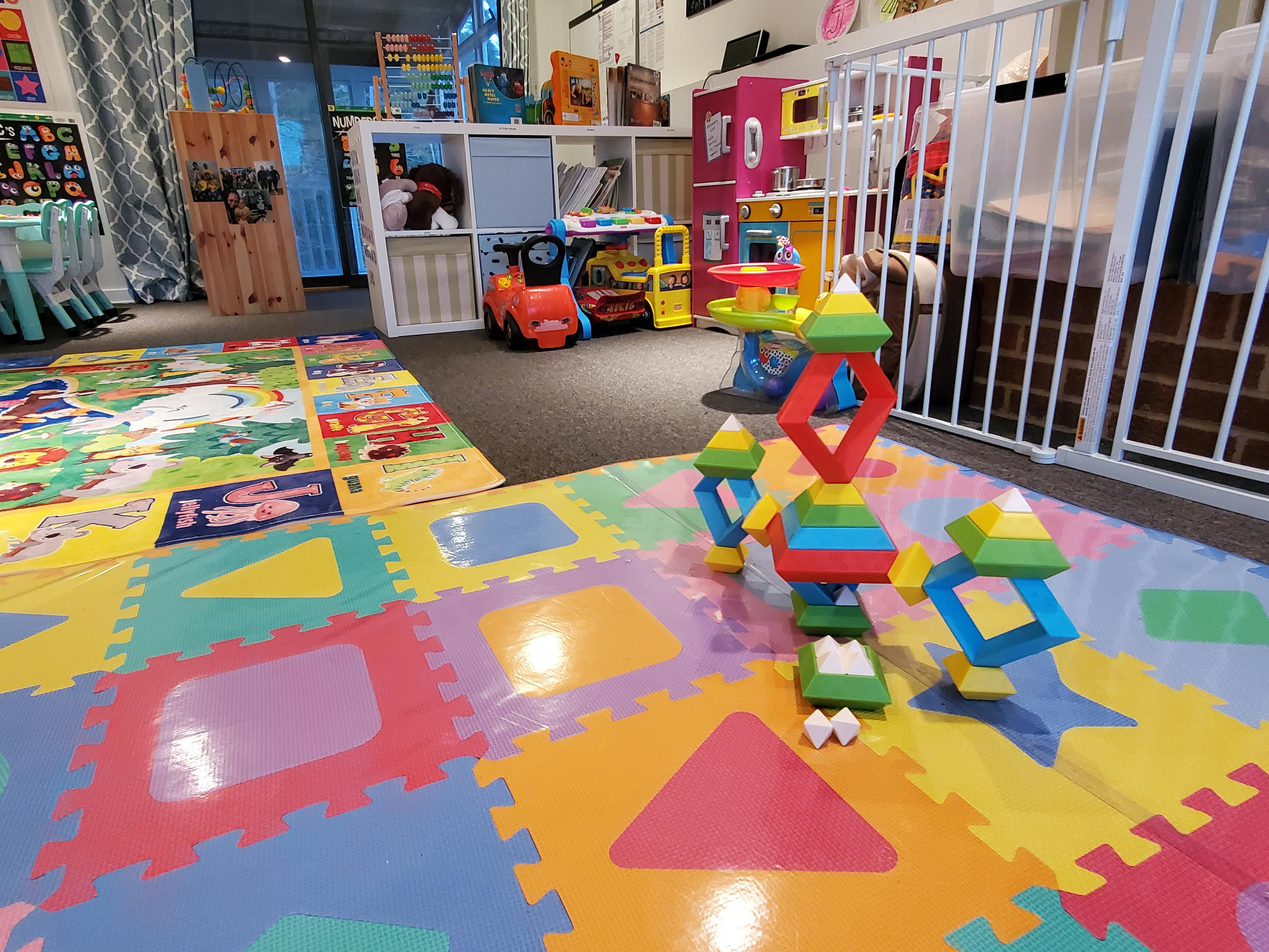 Colorful play area with foam mats and building blocks