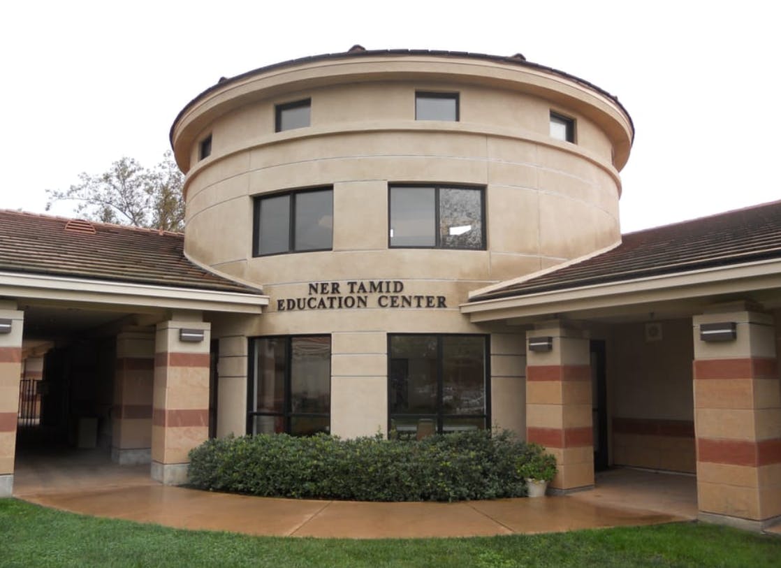 Building with "Ner Tamid Education Center" on the facade