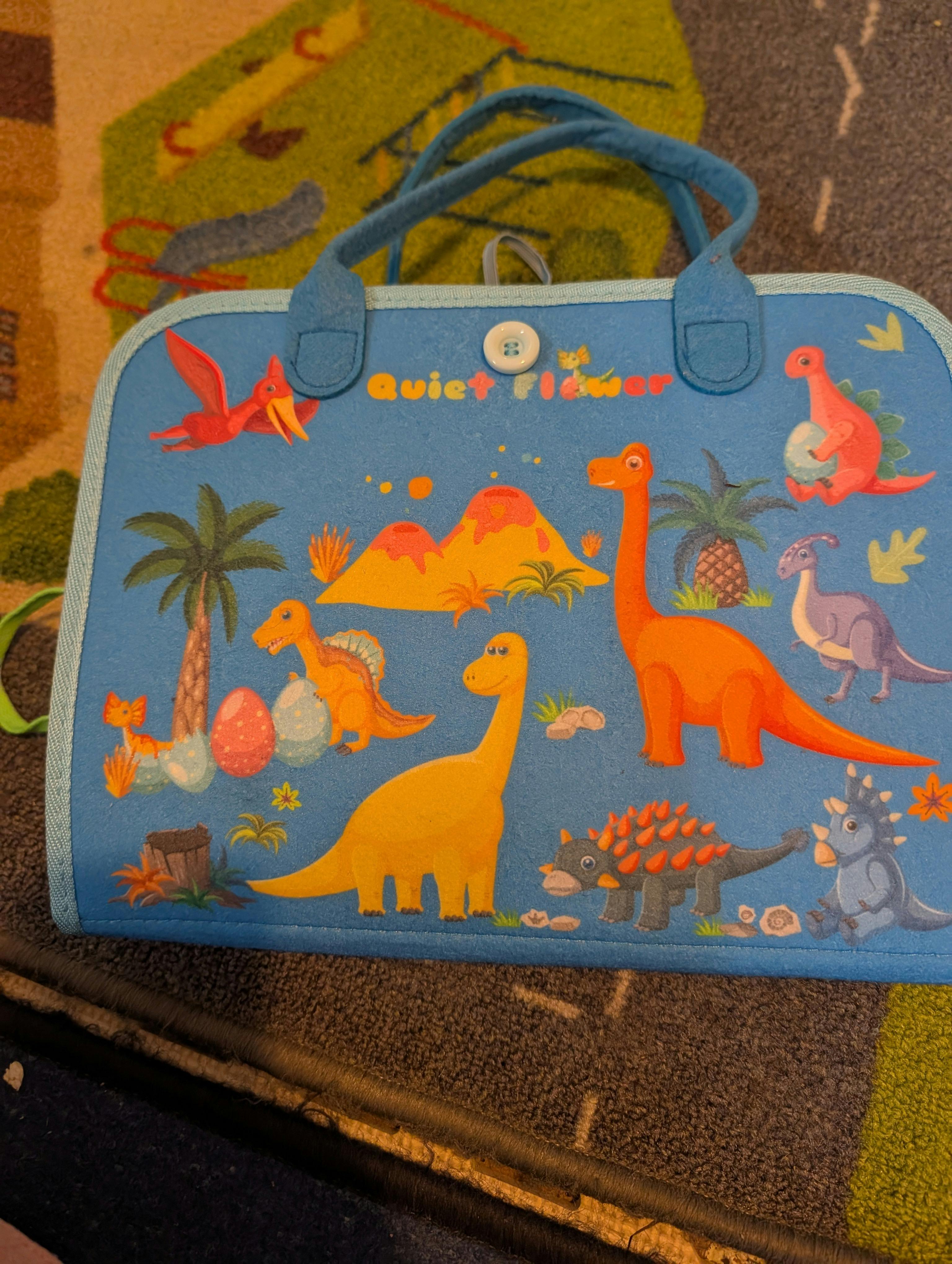Blue fabric toy storage case with dinosaur illustrations
